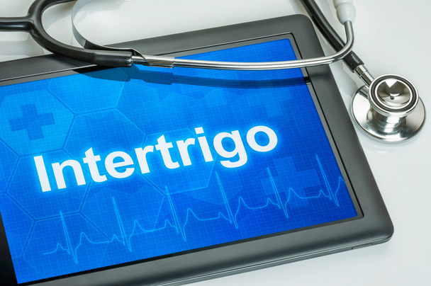 Tableta con el diagnóstico Intertrigo en la pantalla
 - Foto, imagen