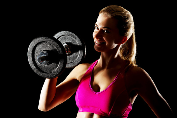 Young sweat woman woman lifting dumbbells - Photo, Image