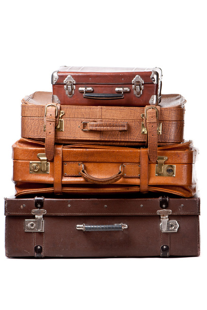 Old suitcases isolated on a white background - 写真・画像