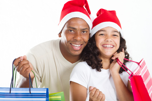 gelukkig vader en dochter met kerstinkopen tassen - Foto, afbeelding