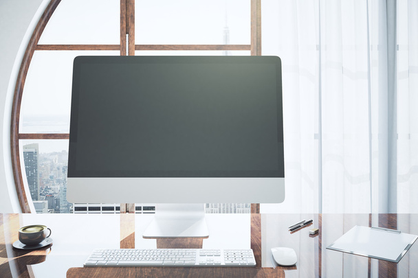 Designer desktop with blank monitor - Фото, изображение