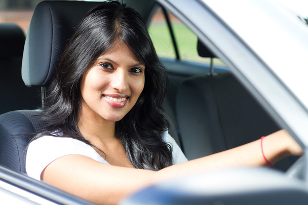 Young indian woman driving a car - Foto, Imagen