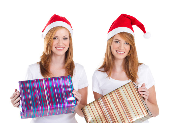 Young women holding christmas presents - Фото, изображение