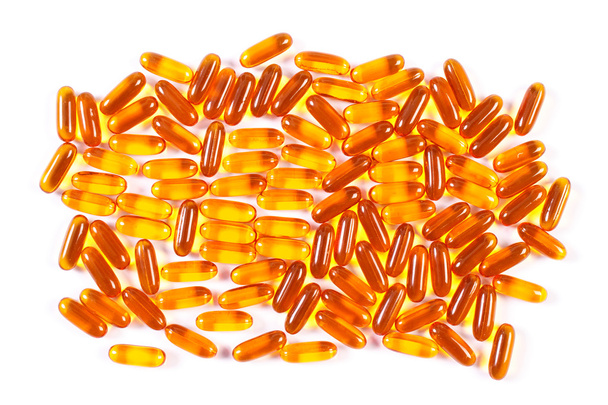 Orange medical capsules on white background, health care concept - Foto, Imagem