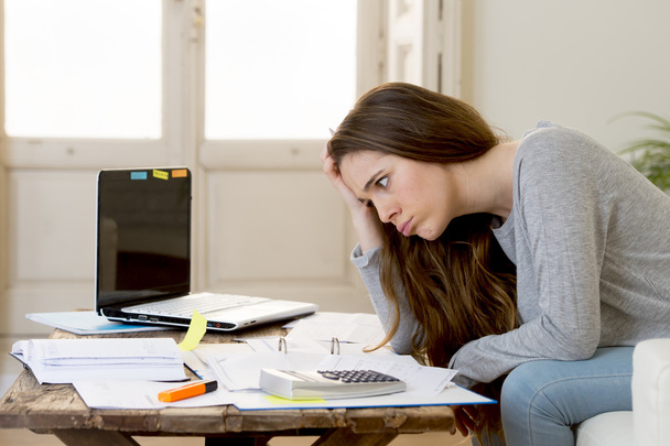 worried woman suffering stress doing domestic accounting paperwork bills and invoices  - Φωτογραφία, εικόνα