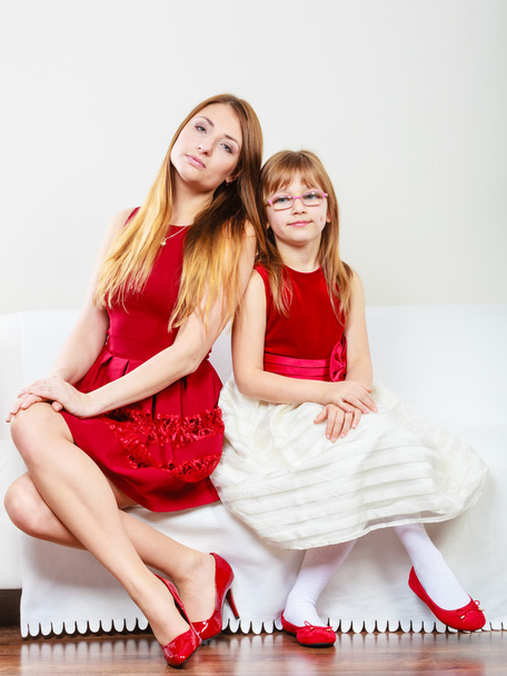 Mother and daughter posing together - 写真・画像