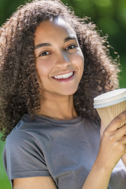 Mixed Race African American Teenager Woman Drinking Coffee - 写真・画像