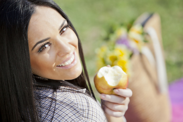 Girl with an apple - Foto, imagen