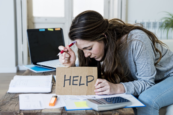 young woman asking for help suffering stress doing domestic accounting paperwork bills - 写真・画像