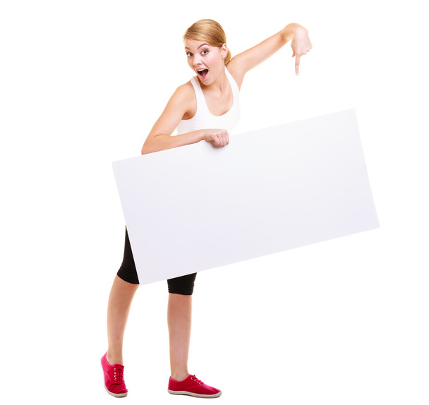 Fitness sporty woman holding blank empty ad banner - Zdjęcie, obraz