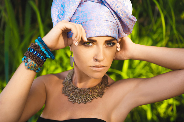 close-up portrait of beautiful young sensual sexy woman with turban on head  - Fotó, kép