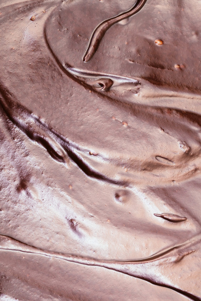 oppervlak van zoete gesmolten chocolade - Foto, afbeelding