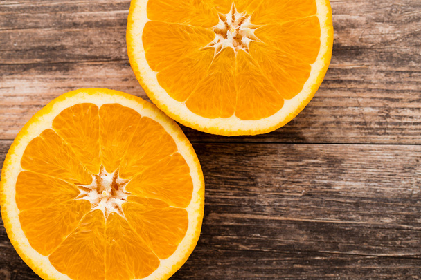 Orange slice on the grey  background. - Foto, Bild