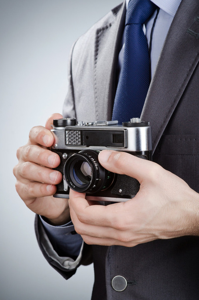 Photographer man with vintage camera - Фото, изображение