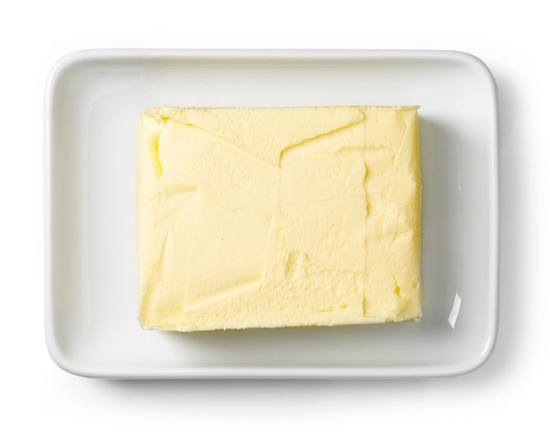 Assiette au beurre isolée sur blanc, d'en haut
 - Photo, image
