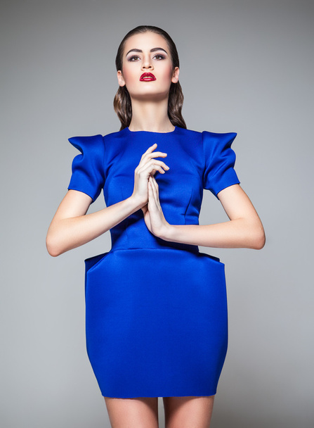 Portrait of fashionable woman in blue dress with bright make-up - Foto, Imagen