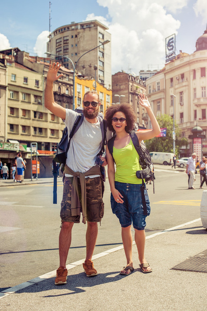 Happy couple of tourists enjoying their trip - Valokuva, kuva