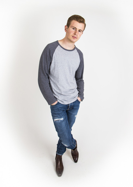 cool boy with cool facial expression  poses in studio  - Fotografie, Obrázek
