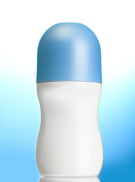 Deodorant on blue background - Zdjęcie, obraz