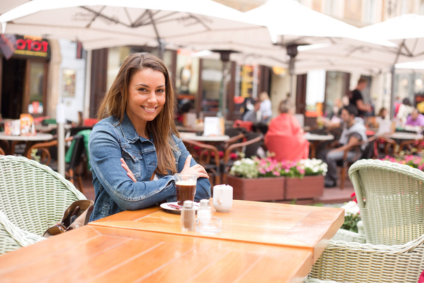 young woman enjoying coffee - Photo, Image