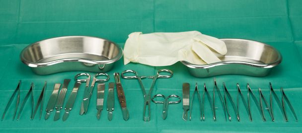 Medical instruments and glove - Photo, Image