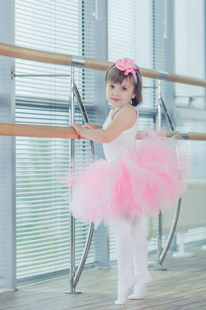 Adorable child dancing classical ballet in studio. - 写真・画像