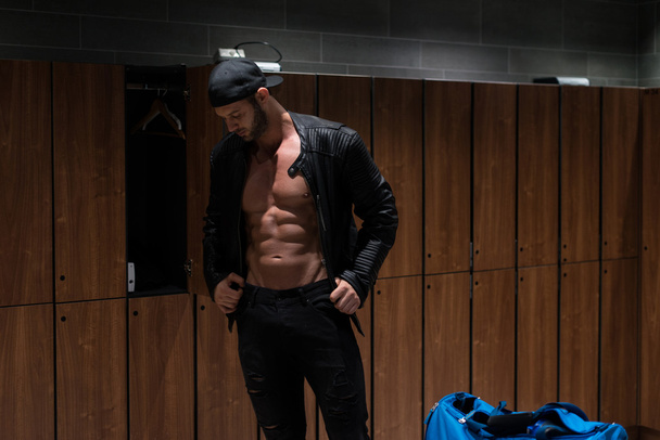 Man In Leather Jacket Standing In Locker Room - Photo, image