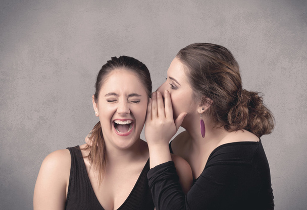 girl telling secret things to her girlfriend - Foto, Imagem