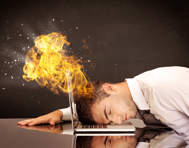 Stressed business man's head is burning - Фото, зображення
