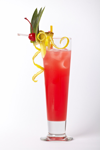 Pink cocktail drink with lemon, pineapple and cherry isolated on white background - Foto, afbeelding