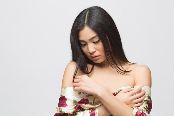 Fashion asian lady in dress in studio - Foto, Imagen