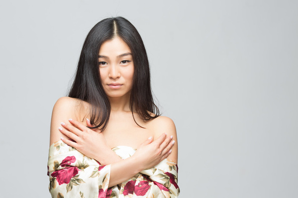 Fashion asian lady in dress in studio - Photo, image