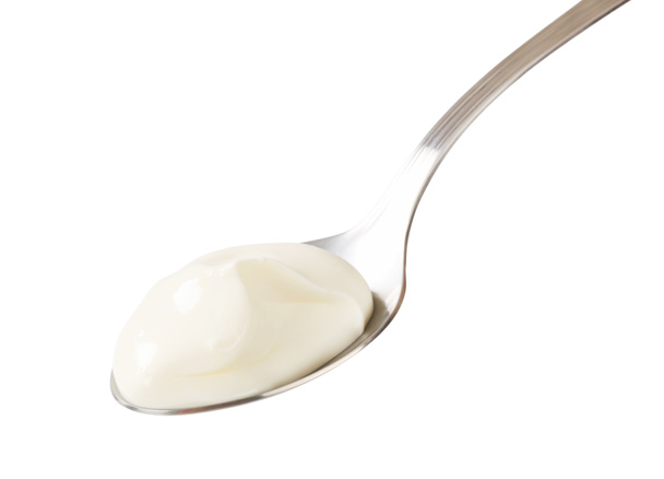 Yogur blanco en una cuchara
 - Foto, imagen