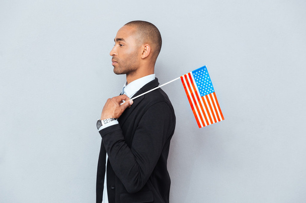 Profile of african american young man with US flag - Φωτογραφία, εικόνα