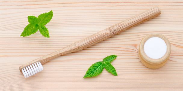 wood toothbrush and xylitol, soda, powder, salt, mint on wooden - Photo, Image