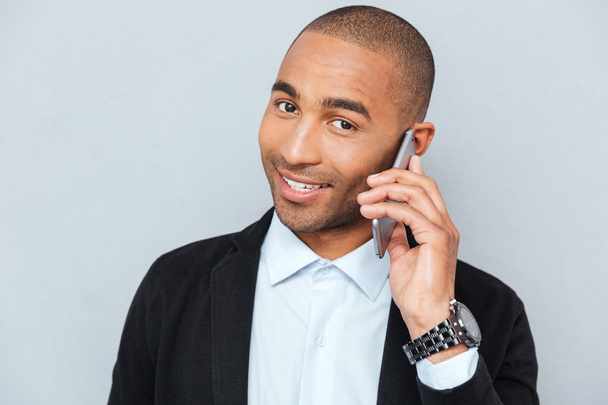Close-up portrait of a man talking on mobile phone - Photo, image