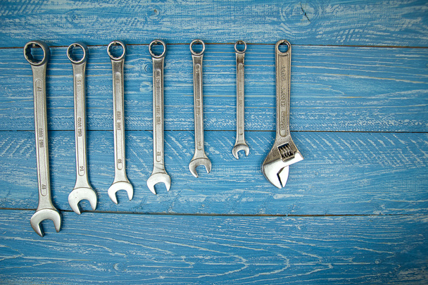 Set of wrenches hanging on a wooden board - Photo, Image