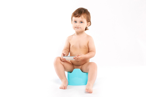 child sitting on the potty - Фото, изображение