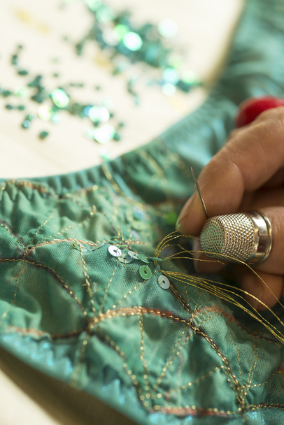 Gold Thread Through a Sequin on Green Garment - Φωτογραφία, εικόνα