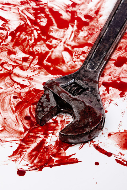 Wrench in blood  on background - Zdjęcie, obraz