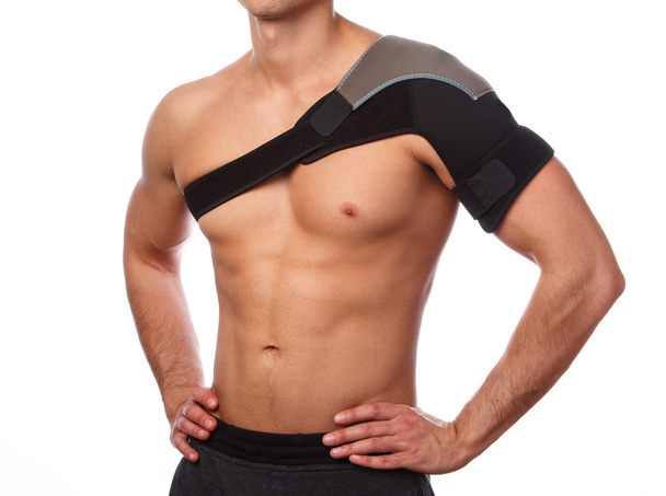 Man with a support bandage on  shoulder - Fotoğraf, Görsel