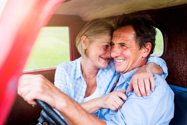 Close up of senior couple inside a pickup truck - Zdjęcie, obraz