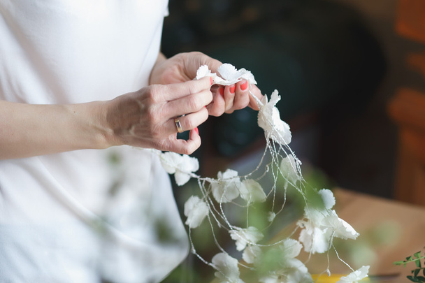 Florist at work: woman making floral composition of different flowers - Foto, immagini