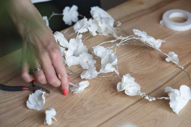 Florist at work: woman making floral composition of different flowers - Fotografie, Obrázek