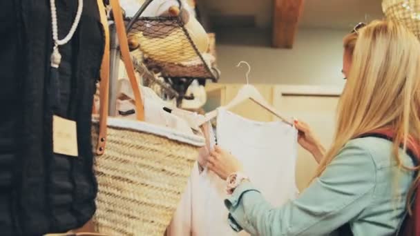 Woman Shopping for Clothing - Felvétel, videó