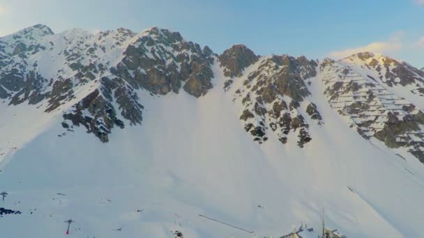 Grand rocky mountain range covered with snow, avalanche danger, risky expedition - Footage, Video