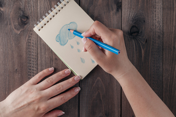 Hand draw at rainny on notebook - Foto, imagen