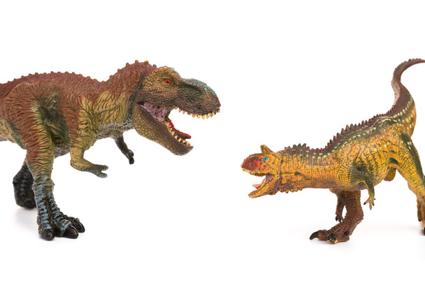 Tyrannosaurus en carnotaurus speelgoed op wit - Foto, afbeelding