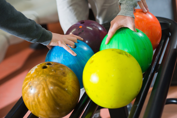 Three friends choosing their bowling balls - Фото, зображення