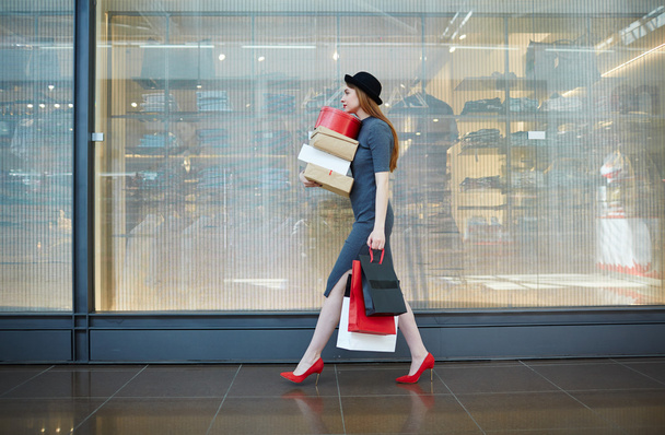 woman walking with boxes - Photo, Image